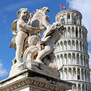 Cupid Statue and Leaning Tower of Pisa, Piazza dei Miracoli, Pisa, Italy