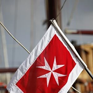 Flag with a Maltese cross in Valletta, Malta