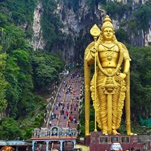 Giant golden statue of the god Murugan at the entrance of the Batu Caves, a Hindu shrine in Kuala Lumpur, Malaysia