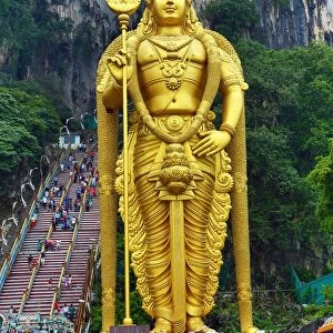 Giant golden statue of the god Murugan at the entrance of the Batu Caves, a Hindu shrine in Kuala Lumpur, Malaysia