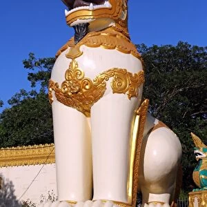 Giant lion statue at the entrance of the Shwedagon Pagoda, Yangon, Myanmar