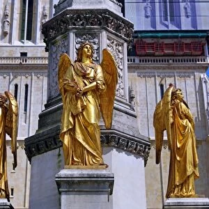 Gold angel statue on the column beside Zagreb Cathedral in Zagreb, Croatia