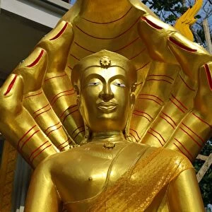 Gold Buddha statue at Wat Khao Phra Bat in Pattaya, Thailand