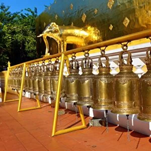 Gold elephant statue and bells on the chedi at Wat Phra Singh Temple in Chiang Mai
