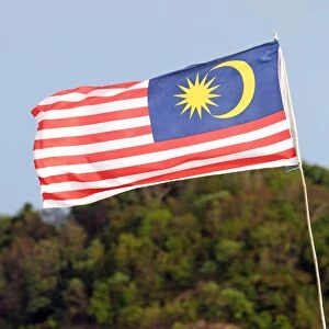 Malaysian flag flying on the beach in Pantai Cenang, Langkawi, Malaysia