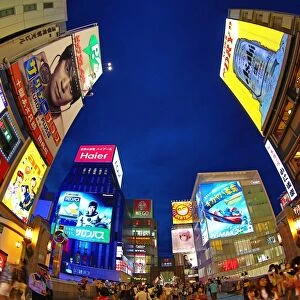 Night scene of illuminations and neon lights on buildings and shops and Kani Doraku