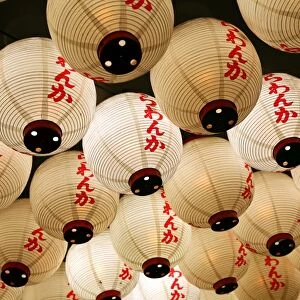Night street scene of Japanese paper lanterns in Shinjuku, Tokyo, Japan