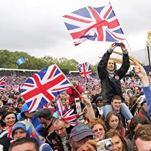 Patriotic crowds waving union jack flags at the Queen Elizabeth II Diamond Jubilee Celebrations, London