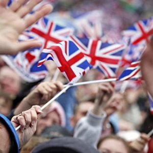 Patriotic crowds waving union jack flags at the Queen Elizabeth II Diamond Jubilee Celebrations, London