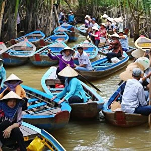 People on Sampan boats on canals on Con Lan (Unicorn) Island, near My Tho, Mekong Delta