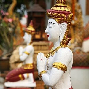 Praying statue at Wat Lam Chang Temple in Chiang Mai, Thailand