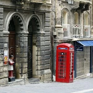 Red English telephone box in Valletta, Malta