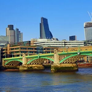 River Thames with Southwark Bridge and the City of London skyline in London, England