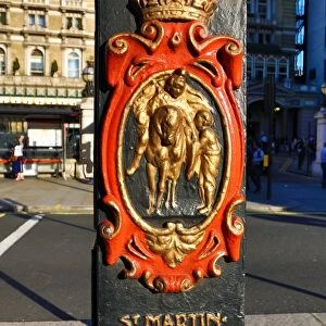St Martins in the Fields crest on a lamppost at Charing Cross, London, England