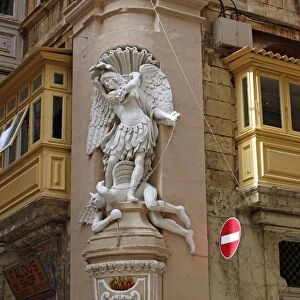 Statue of Saint Michael on buildings in Valletta, Malta