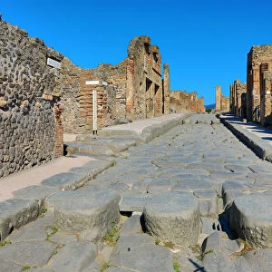 Street and ruins of houses in the ancient Roman city of Pompeii, Italy