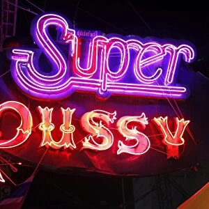 Super pussy neon sign in Patpong Night Market in Bangkok, Thailand