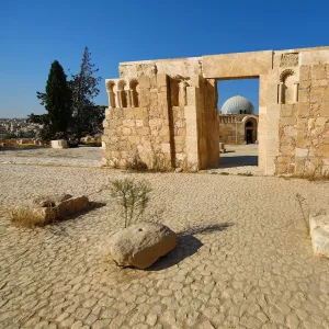 The Umayyad Palace seen through a ruined wall, Amman, Jordan