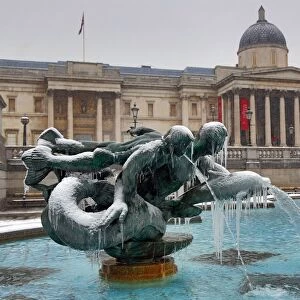 Winter snow, ice and frozen fountains, Trafalgar Square, London