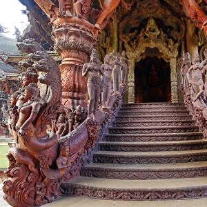 Wooden stairs and carvings at the Sanctuary of Truth Temple, Prasat Sut Ja-Tum, Pattaya, Thailand showing wood stairs