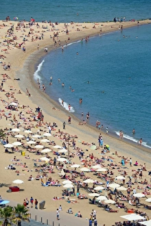 Aerial view of crowds on the crowded beach, Barcelona, Spain Aerial view of crowds on the crowded beach, Barcelona, Spain