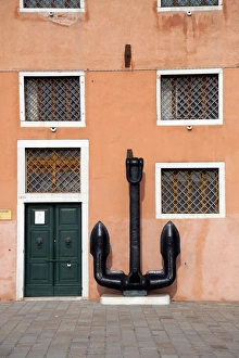 Anchor and the wall of a building with windows in Venice, Italy Anchor and the wall of a building with windows in Venice, Italy