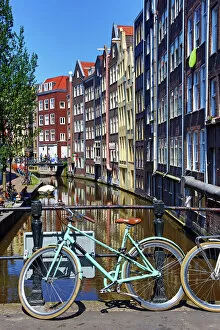 Amsterdam Collection: Bicycles on bridge on Oudezijds Achterburgwal canal, Amsterdam