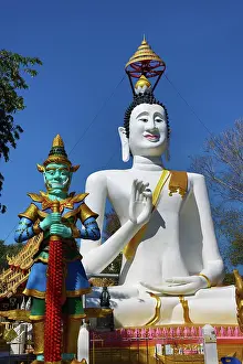big white buddha statue temple guardian wat ko kaew pitsadan temple