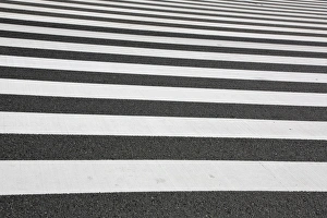 Black and white lines of a Japanese zebra pedestrian crossing in Ginza, Tokyo, Japan Black and white lines of a Japanese zebra pedestrian crossing in Ginza, Tokyo, Japan