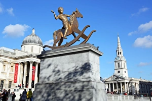 Boy on a rocking horse statue in Trafalgar Square in London Boy on a rocking horse statue in Trafalgar Square in London