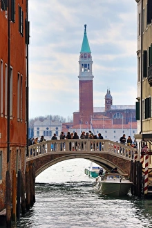 Bridge over a canal and San Giorgio Maggiore in Venice, Italy Bridge over a canal and San Giorgio Maggiore in Venice, Italy