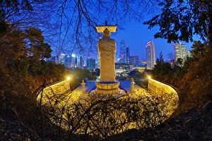 Images Dated 27th March 2016: Buddha statue and city skyline, Bongeunsa Temple, Seoul, Korea