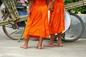 Vientiane, Laos Collection: Buddhist Monks buying brushes, Vientiane, Laos