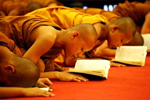 Buddhist monks praying at Wat Chedi Luang in Chiang Mai, Thailand Buddhist monks praying at Wat Chedi Luang in Chiang Mai, Thailand