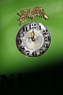 Images Dated 2nd October 2011: Clock on green background