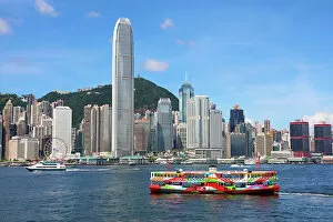 Hong Kong Collection: Colourful Ferry crossing Victoria Harbour and Skyline, Hong Kong, China