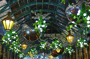 Covent Garden Christmas decorations and lights shaped like mistletoe in London