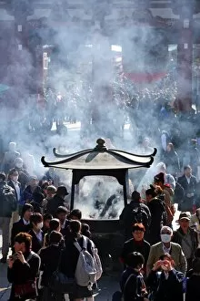 Images Dated 31st January 2014: Crowds of people burning incense at the Shinto Shrine at Senso-Ji Bhuddist Temple in Asakusa in