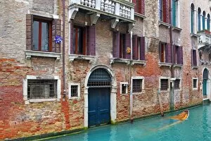 Venice Collection: Doorway of a building on a canal in Venice, Italy