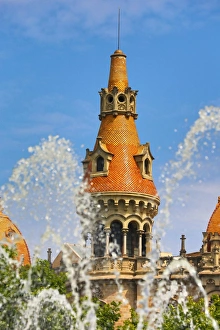 Fountain in the Placa de Catalunya and turret roofs of buildings in the Passeig de Gracia in Barcelona, Spain Fountain in the Placa de Catalunya and turret roofs of buildings in the Passeig de Gracia in Barcelona, Spain