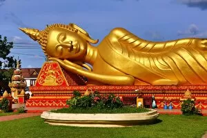 Vientiane, Laos Collection: Giant gold reclining sleeping Buddha statue near Wat That Luang Temple, Vientiane, Laos