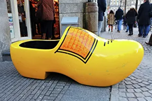 Giant wooden souvenir clog outside a souvenirs shop for clogs in Amsterdam, Holland Giant wooden souvenir clog outside a souvenirs shop for clogs in Amsterdam, Holland