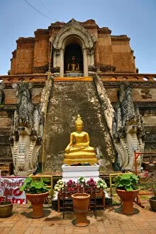 Thai Temples Collection: Gold Buddha statue and the Chedi at the Wat Chedi Luang Temple in Chiang Mai, Thailand