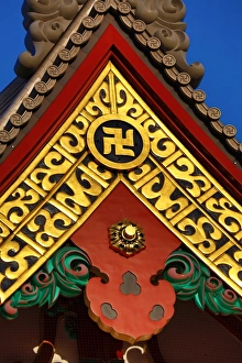 Gold Buddhist cross symbol on a giant vase at the Sensoji Asakusa Kannon Temple, Tokyo, Japan Gold Buddhist cross symbol on a giant vase at the Sensoji Asakusa Kannon Temple, Tokyo, Japan