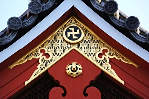 Gold Buddhist cross symbol on a roof at the Sensoji Asakusa Kannon Temple, Tokyo, Japan Gold Buddhist cross symbol on a roof at the Sensoji Asakusa Kannon Temple, Tokyo, Japan
