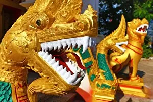 Images Dated 10th September 2015: Gold Naga statue with teeth near Wat That Luang Temple, Vientiane, Laos