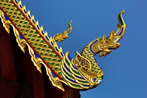 Gold roof decorations at Wat Sum Pow Temple in Chiang Mai, Thailand Gold roof decorations at Wat Sum Pow Temple in Chiang Mai, Thailand