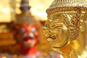 Images Dated 6th February 2016: Golden Kinnara staue and Yaksha Demon at the Wat Phra Kaew Royal Palace complex in Bangkok