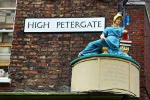 Yorkshire Collection: High Petergate street sign and statue in York, Yorkshire, England