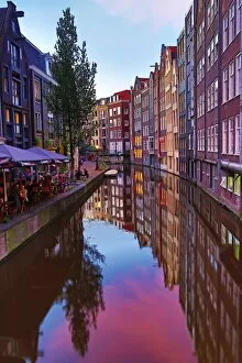 Images Dated 6th June 2016: Houses and restaurants on the Oudezijds Achterburgwal canal at sunset in Amsterdam